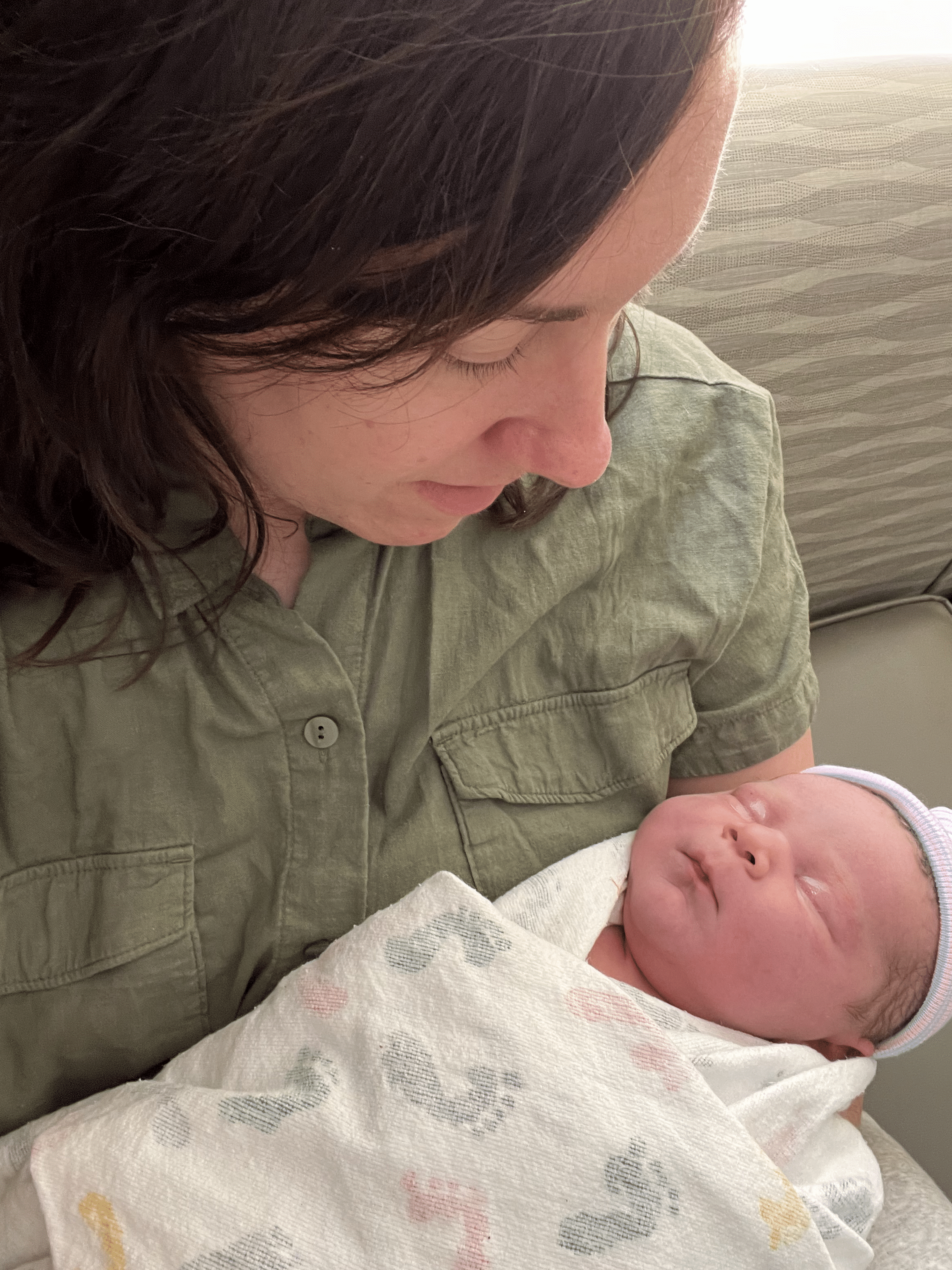 A mother holds a newborn baby