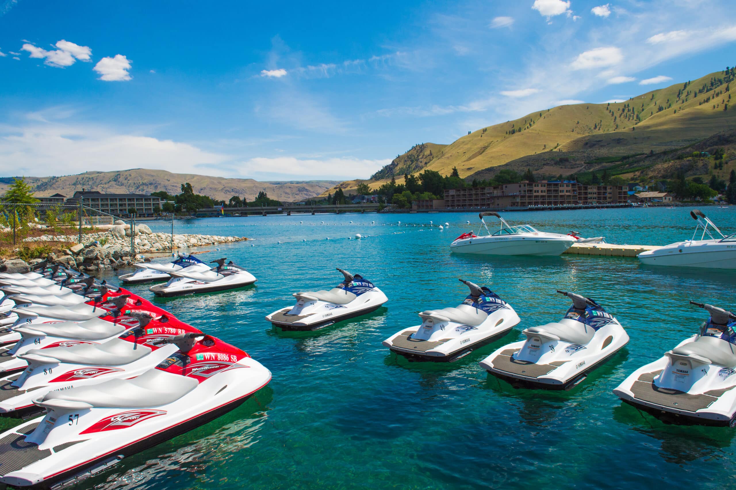 Jetskis sit on a turquoise Lake Chelan