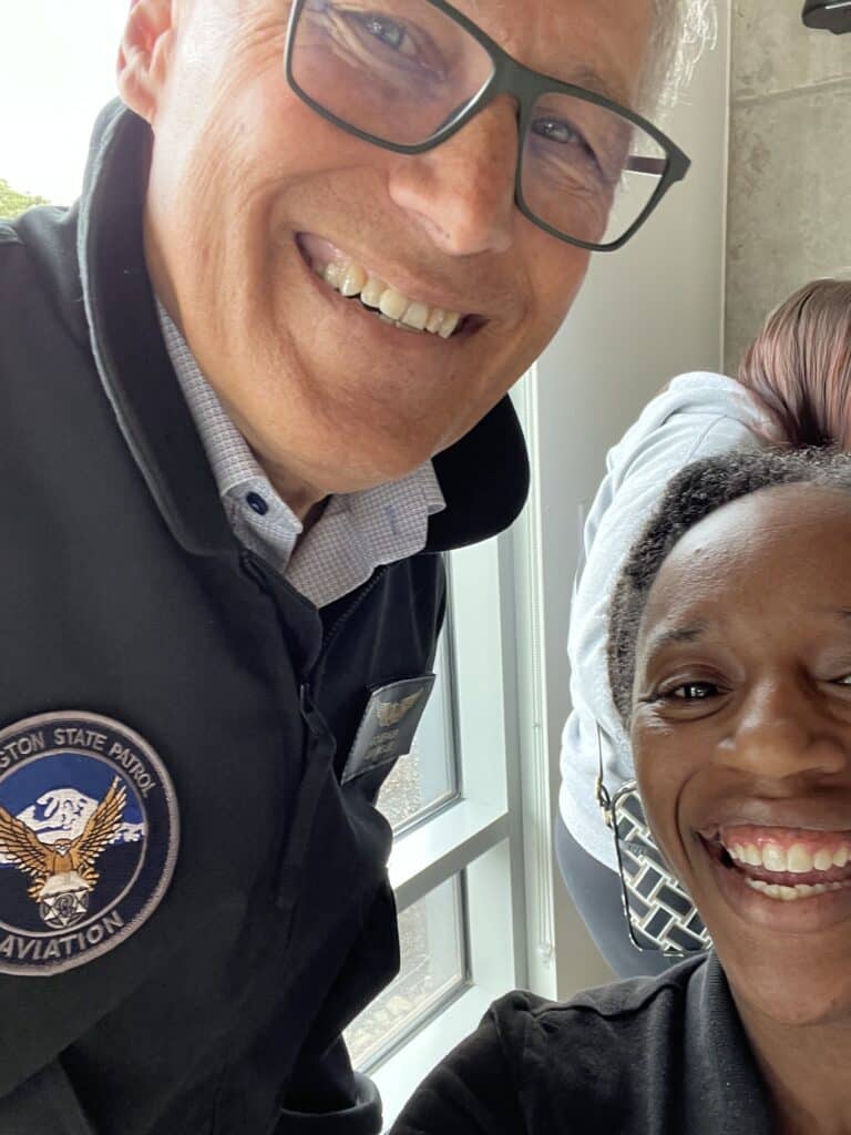 Bended Ear Project founder, Kayla Sanchez smiles with former Washington governor Jay Inslee.