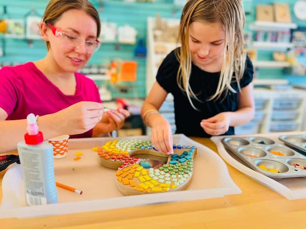 A mom and daughter create a mosaic art piece. Art Spaces in Vancouver.